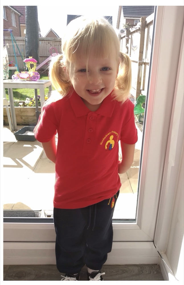 Bella on her first day at Monksdown, in her little red polo shirt